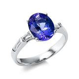 Ring 18 kt WG, 2 Trap. 0,17 ct, TW-si, 1 Tansanit 2,60 ct blau