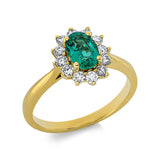 Ring 18 kt GG, 12 Brill. 0,42 ct, TW-si, 1 Smaragd 0,56 ct grün
