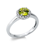Ring 18 kt WG, 14 Brill. 0,14 ct, TW-pi, 1 Peridot 0,82 ct grün