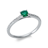 Ring 18 kt WG, 18 Brill. 0,12 ct, TW-si, 1 Smaragd 0,30 ct grün