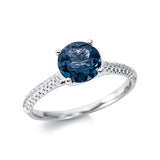 Ring 18 kt WG, 44 Brill. 0,14 ct, TW-si, 1 Topas 1,58 ct Lond. blue