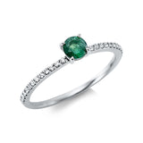 Ring 18 kt WG, 24 Brill. 0,12 ct, TW-si, 1 Smaragd 0,28 ct grün