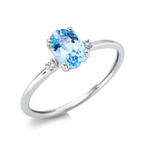 Ring 18 kt WG, 2 Brill. 0,03 ct, TW-si, 1 Topas 0,67 ct Swiss blue