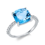 Ring 18 kt WG, 12 Brill. 0,26 ct, TW-si, 1 Topas 4,72 ct blau