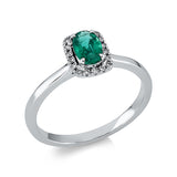 Ring 18 kt WG, 18 Brill. 0,07 ct, TW-si, 1 Smaragd 0,47 ct grün