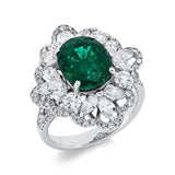 Ring 18 kt WG, 12 Nav. 0,92 ct, TW-vsi/si, 88 Brill. 0,86 ct, TW-vsi/si, 1 Smaragd 3,16 ct grün