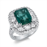 Ring 18 kt WG, 10 Oval 1,78 ct, TW-si, 58 Brill. 0,96 ct, TW-si, 1 Smaragd 6,36 ct grün