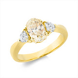 Ring 18 kt GG, 2 Herzschl. 0,35 ct, TW-si, 1 Oval 1,18 ct, gelb