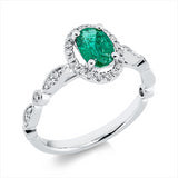 Ring 18 kt WG, 32 Brill. 0,26 ct, TW-si, 1 Smaragd 0,72 ct grün