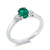 Ring 18 kt WG, 2 Brill. 0,20 ct, TW-si, 1 Smaragd 0,65 ct grün