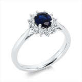 Ring 18 kt WG, 12 Brill. 0,30 ct, TW-si, 1 Saphir 0,91 ct blau