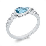 Ring 14 kt WG, 28 Brill. 0,15 ct, TW-si, 1 Topas 1,02 ct blau