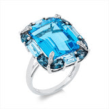 Ring 18 kt WG, 12 Brill. 0,08 ct, TW-si, 4 Topase 1,60 ct blau, 8 Topase 1,90 ct Lond. blue, 1 Topas 14,20 ct blau