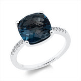 Ring 18 kt WG, 10 Brill. 0,12 ct, TW-si, 1 Topas 4,38 ct Lond. blue