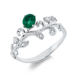 Ring 18 kt WG, 5 Brill. 0,11 ct, TW-si/pi, 7 Brill. 0,04 ct, TW-si/pi, 1 Smaragd 0,31 ct grün