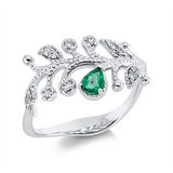 Ring 18 kt WG, 6 Brill. 0,06 ct, TW-si/pi, 6 Brill. 0,04 ct, TW-si/pi, 1 Smaragd 0,14 ct grün