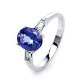 Ring 18 kt WG, 2 Trap. 0,13 ct, TW-si, 1 Tansanit 2,32 ct blau