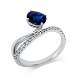 Ring 18 kt WG, 16 Brill. 0,21 ct, TW-si, 4 Brill. 0,02 ct, TW-si, 1 Saphir 0,99 ct blau