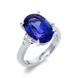 Ring 18 kt WG, 6 Brill. 0,24 ct, TW-si, 1 Tansanit 8,36 ct blau
