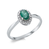 Ring 18 kt WG, 16 Brill. 0,10 ct, TW-si, 1 Smaragd 0,45 ct grün