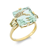 Ring 18 kt GG, 4 Peridot 0,60 ct grün, 1 Amethyst 9,70 ct grün