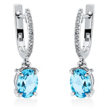 Ohrschmuck 18 kt WG, 30 Dia. 0,09 ct, TW-si, 2 Topase 2,67 ct blau