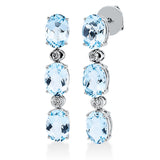 Ohrschmuck 18 kt WG, 4 Brill. 0,12 ct, TW-si, 6 Topase 4,60 ct sky blue