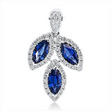 Anhänger 18 kt WG, mit Öse, 63 Brill. 0,43 ct, TW-si, 3 Saphire 1,21 ct blau