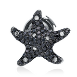 Brosche 18 kt WG, Fassung teils schwarz rhodinie, 8 Brill. 0,09 ct, F-pi, 79 Brill. 0,87 ct, schwarz