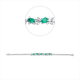 Armband 18 kt WG, 10 Nav. 0,53 ct, 8 Trop. 0,63 ct, 74 Brill. 1,38 ct, TW-vsi/si, 5 Smaragde 1,62 ct grün