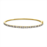 Armreif 18 kt GG, 15 Brill. 0,84 ct, braun-si, 16 Bag. 0,28 ct, F-vsi/si, 32 Brill. 0,16 ct, TW-si