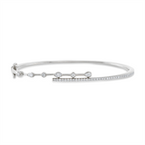 Armreif 18 kt WG, 1 Nav. 0,05 ct, TW-vsi, 2 Tropfen 0,07 ct, TW-vsi, 40 Brill. 0,32 ct, TW-si
