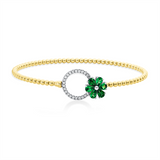 Armreif 18 kt GG+WG, 22 Brill. 0,17 ct, F-vsi, 6 Tsavorith 0,93 ct grün